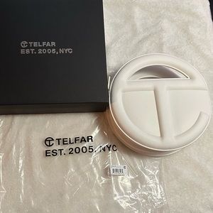 White circle Telfar bag.